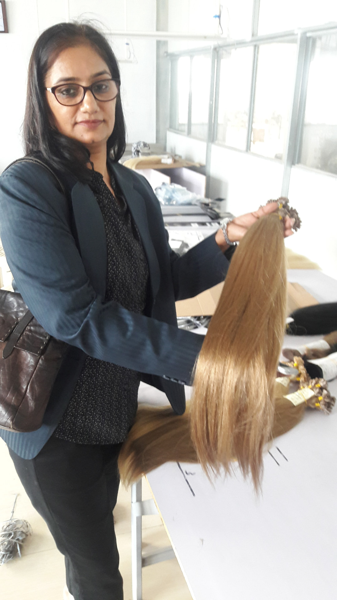 Raw hair being sorted and aligned by hand before construction